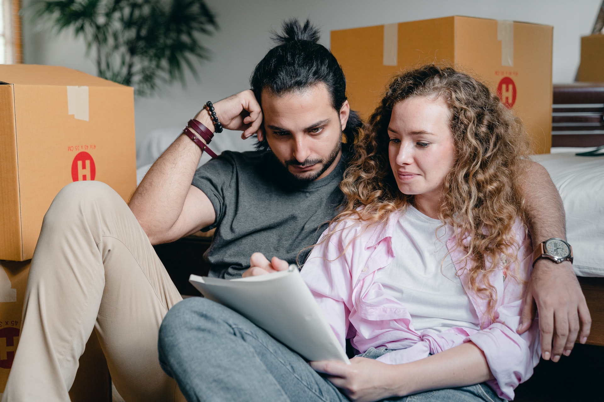 man and woman sitting on couch